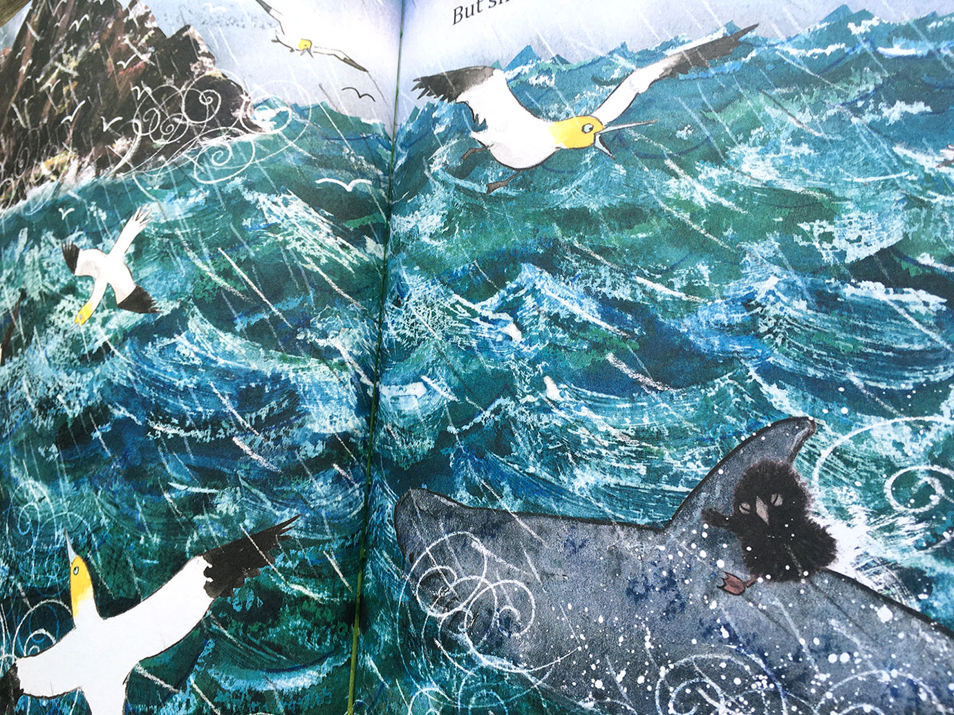Puffling and the Stormy Sea scene where Puffling travels on the basking shark to small skellig